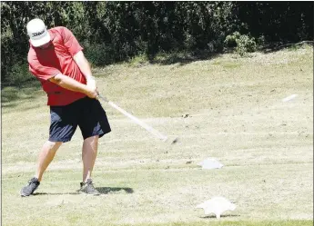  ?? Westside Eagle Observer/MIKE ECKELS ?? Robert Peschol’s tee shot launches the ball (right, center) toward the green during the 2020 Decatur Police Department Golf Tournament fundraiser at The Creeks in Cave Springs Friday afternoon. This golfer’s shot hit the green and rolled to within 10 feet of the pin.