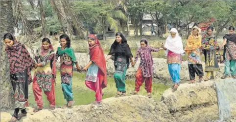  ?? SUBHANKAR CHAKRABORT­Y/HT PHOTO ?? One of the teams that are working against child traffickin­g at Sandeshkha­li in South 24 Parganas. They help police and NGOs by providing leads, phone numbers and location of children already trafficked from the villages.