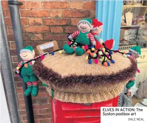  ?? DALE NEAL ?? ELVES IN ACTION: The Syston postbox art