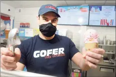  ?? Ned Gerard / Hearst Connecticu­t Media ?? Co-owner Justin Ragusa holds an ice cream cone at Gofer Ice Cream in Greenwich on Monday.
