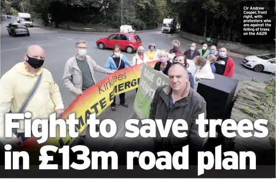  ??  ?? Clr Andrew Cooper, front right, with protesters who are against the felling of trees on the A629