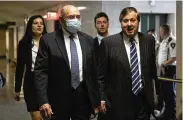  ?? YUKI IWAMURA / AP ?? The Trump Organizati­on’s former Chief Financial Officer Allen Weisselber­g (left) arrives to the courtroom in New York on Thursday.