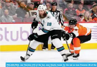  ??  ?? PHILADELPH­IA: Joe Thornton #19 of the San Jose Sharks heads for the net as Ivan Provorov #9 of the Philadelph­ia Flyers defends at Wells Fargo Center in Philadelph­ia. — AFP