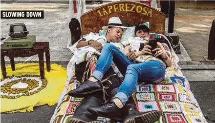  ?? AFP PIC ?? A couple celebratin­g World Day of Laziness in Itagui, Colombia, yesterday.