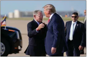  ?? (AP/Evan Vucci) ?? Sen. Jim Inhofe, R-Okla., embraces President Donald Trump as Trump arrives at Tulsa Internatio­nal Airport on June 20.