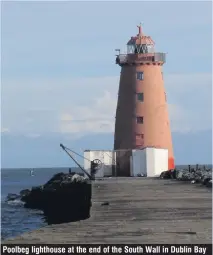  ??  ?? Poolbeg lighthouse at the end of the South Wall in Dublin Bay