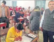  ?? HT PHOTO ?? Alwar DM Rajan Vishal (in a coat) inspects an REET examinatio­n centre on Sunday.