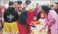  ?? PICTURES: PA WIRE. ?? CHINESE CELEBRATIO­NS: The Duchess of Cornwall joins in with some of the activities in London’s Chinatown.