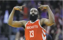  ?? Michael Wyke / Associated Press ?? Houston guard James Harden hit five three-pointers en route to a 22-point night in the Rockets’ win over the Warriors.