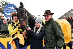  ?? SEB DALY/ SPORTSFILE ?? Delighted groom Ashling O’Brien, jockey David Mullins and trainer Willie Mullins with Al Boum Photo after winning the Ryanair Gold Cup Novice Steeplecha­se the Easter Festival at Fairyhouse yesterday