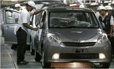  ?? – Reuters photo ?? Improvemen­t from OMIA is expected will be driven by stable demand for Perodua alloy wheels, better production efficiency and possible capacity take-up by CD, analysts observed.