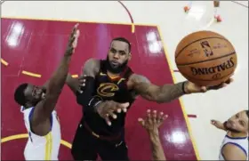  ?? GREGORY SHAMUS — POOL PHOTO VIA AP, FILE ?? In this file photo, Cleveland Cavaliers’ LeBron James shoots against Golden State Warriors’ Draymond Green during the first half of Game 3 of basketball’s NBA Finals in Cleveland. Two people familiar with the decision say James has told the Cavaliers...