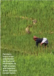  ??  ?? Farmers learn triedand-tested agricultur­al techniques to fight erosion, and improve water and soil conservati­on.