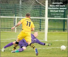  ?? Picture: Steve Crispe FM4551922 ?? Ashford’s Rory Hill tests Rochester keeper Michael Elder