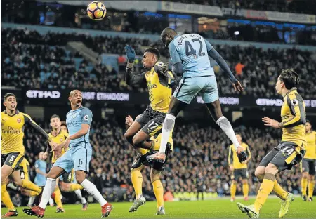  ?? Picture: AFP ?? TOWERING INFERNO: Manchester City's midfielder Yaya Toure, seen here towering high for the ball during the English Premier League match against Arsenal, says he he wants to take the Citizens to even greater heights