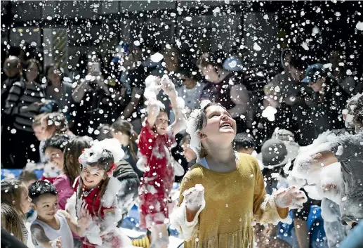  ?? MONIQUE FORD/STUFF ?? A delighted Niamae van Deventer, 6, revelled in foam ‘‘snow’’ at the capital’s Very Welly Christmas parade event yesterday. The free event drew hundreds of families to Wellington’s Lambton Quay over two days, with live music, dancers, and activities to entertain the little ones, plus the promise of seeing the big jolly man in red before he returns to the North Pole to get ready for Christmas.