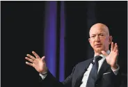  ?? Jim Watson / AFP / Getty Images ?? Jeff Bezos says the National Enquirer threatened to publish risque texts that he sent to a female friend.