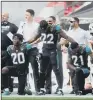  ??  ?? PROTEST: Jacksonvil­le Jaguars players kneel in protest before the NFL match at Wembley yesterday.