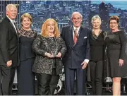  ??  ?? Receiving an award at the event from Pat Riley, chairman of the board of LeadingRE, left, were John Daugherty, Realtors representa­tives Cheri Fama, president; Anne Incorvia, executive vice president; John Daugherty, chairman and CEO; Becky Page,...