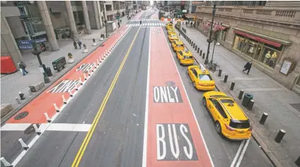  ?? MARY ALTAFFER ASSOCIATED PRESS ?? Yellow cabs line an empty 42nd Street on Wednesday waiting for fares outside Grand Central Terminal in New York. For the millions of Americans living under some form of lockdown to curb the spread of the new coronaviru­s, not knowing when the restrictio­ns will end is a major source of anxiety.