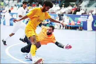  ??  ?? Goalkeeper tries to block opponent from scoring a goal.