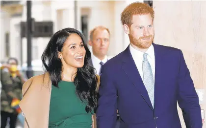  ?? KIRSTY WIGGLESWOR­TH/AP ?? Prince Harry and Meghan Markle.