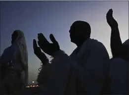  ?? AMR NABIL — THE ASSOCIATED PRESS ?? Muslim pilgrims pray on top of the the Mountain of Mercy on the Plain of Arafat during the annual hajj pilgrimage near the holy city of Mecca, Saudi Arabia, on Friday.