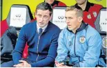  ??  ?? Leading the way Assistant manager James Fowler (right) with Saints gaffer Jack Ross