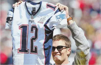  ?? STAFF FILE PHOTO, ABOVE, BY MATT STONE; COURTESY PHOTO, LEFT ?? HERO’S HERO: Seattle sports memorabili­a collector and New England Patriots fan Dylan Wagner, left, hopes to hear from Tom Brady, above, after he helped the FBI locate Brady’s stolen jerseys.