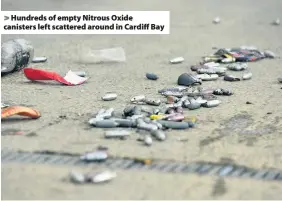  ??  ?? > Hundreds of empty Nitrous Oxide canisters left scattered around in Cardiff Bay