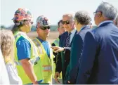  ?? MANUEL BALCE CENETA/AP ?? President Joe Biden speaks with workers during the groundbrea­king ceremony for a huge new computer chip facility Friday in New Albany, Ohio.