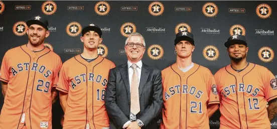  ?? Steve Gonzales / Staff photograph­er ?? Jeff Luhnow, center, the Astros’ president of baseball operations and general manager, on Friday introduces the team’s acquisitio­ns made before Wednesday’s trade deadline. From left are relief pitchers Joe Biagini and Aaron Sanchez, former Cy Young Award winner Zack Greinke, and catcher Martin Maldonado, who was one of six Astros to homer Friday in a 10-2 win over the Seattle Mariners at Minute Maid Park. Coverage in Sports,