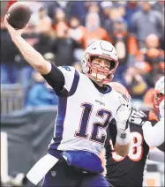  ?? Andy Lyons / Getty Images ?? The Patriots’ Tom Brady throws a pass during the first half against the Bengals on Sunday in Cincinnati.