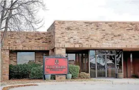  ?? [OKLAHOMAN ARCHIVES PHOTO] ?? Tate Publishing’s corporate headquarte­rs in Mustang was among properties seized by a bank and auctioned to retire debt owed to it by Richard Tate and Ryan Tate.