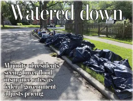  ?? ASSOCIATED PRESS FILE PHOTO ?? Trash is shown on a street in Grosse Pointe Farms on June 27followin­g flooding in the area that overloaded sewer systems, damaged homes and knocked out power for thousands.