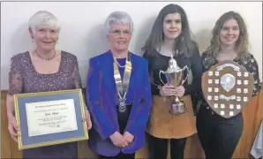  ??  ?? Left to right: Citizen of the year Jane Mayo, Rotary president Margaret Bakes, most promising young musician Amy Paterson and young stockperso­n of the year Kathryn Semple.