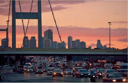  ?? AFP ?? Cars wait in traffic on the Bosphorous Bridge in Istanbul. Foreign investors purchased 5,811 houses in Istanbul in 2016. —