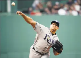  ?? Elise Amendola / Associated Press ?? Rays starting pitcher Yonny Chirinos delivers a pitch during the first inning of Tampa Bay’s 5-1 victory over the Red Sox on Friday in Boston.