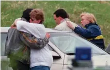  ?? RYAN REMIORZ/THE CANADIAN PRESS FILE PHOTO ?? Family and friends embrace after the search at Westray was called off.