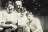  ?? BERNIE SANDERS CAMPAIGN VIA AP ?? This undated photo provided by the Bernie Sanders campaign in July 2019 shows him as a child, center, with his mother, Dorothy; father, Eli; and brother, Larry. For most of his career, Bernie Sanders has avoided sharing details of his own story, rarely linking policy proposals to his personal experience. But relatives and former classmates who grew up alongside Sanders — and occasional­ly now Sanders himself — say there are clear connection­s between the candidate’s Brooklyn boyhood and his decades of speeches and legislativ­e proposals aimed at leveling the economic playing field.