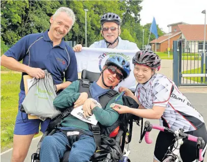  ??  ?? ●●Royal College Manchester student Luke Morrow with his dad Ken and Special Olympian Kiera Byland and her dad Brian