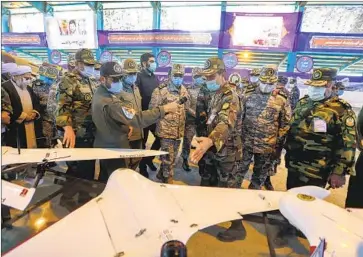  ?? I r anian army ?? THE OWNER of a seized South Korean oil tanker gave a descriptio­n of the raid by Iran that contradict­ed Tehran’s version of events. Iranian Gen. Mohammad Hossein Bagheri, above center, visits a drone display.