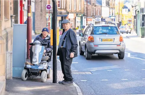  ?? ?? Obstructio­n Scott Pringle, left, next to one of the new crossings with Crieff Community Council chair Harry Thomason