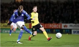  ??  ?? James Maddison scores Leicester’s third goal against Burton Albion. Photograph: James Williamson - AMA/Getty Images