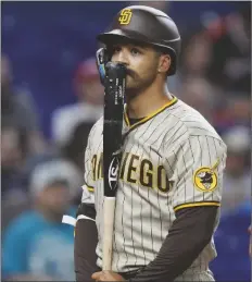  ?? WILFREDO LEE/AP ?? SAN DIEGO PADRES’ TRENT GRISHAM reacts after striking out swinging during the ninth inning of a baseball game against the Miami Marlins on Wednesday in Miami.