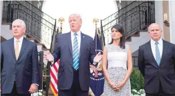  ?? — AFP ?? US President Donald Trump (C) speaks to the press with US Secretary of State Rex Tillerson (L), Ambassador to the United Nations Nikki Haley (2nd R) and United States National Security Adviser H R McMaster at Trump National Golf Club in Bedminster, New...