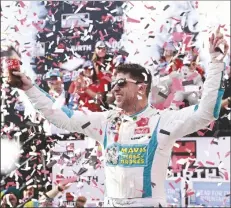  ?? DERIK HAMILTON/AP ?? DENNY HAMLIN celebrates in Victory Lane after winning a NASCAR Cup Series auto race at Dover Motor Speedway on Sunday in Dover, Del.