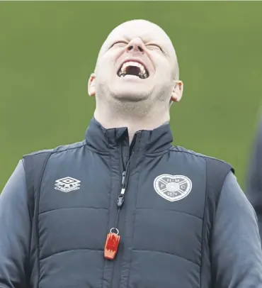  ?? ?? Hearts manager Steven Naismith in good spirits during training at Oriam yesterday