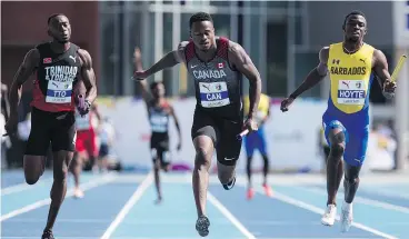  ??  ?? Canada’s Aaron Brown, centre, crosses the finish line for the gold in the men’s 4x100m relay during the NACAC Championsh­ips in Toronto on Sunday. — THE CANADIAN PRESS