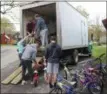  ??  ?? On Saturday, May 4, members of the Colgate Men’s Soccer team help Community Bikes Founder Chuck Fox, left, load bikes into a truck, courtesy of Terry Mosher of Mosher Farms, for the ninth annual Bike Day at Oneida High School.